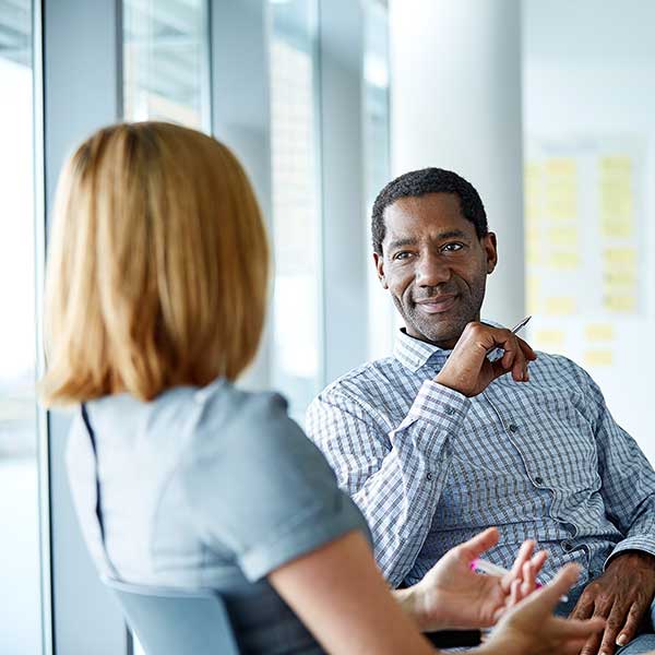 colleagues discuss mortgage contracts